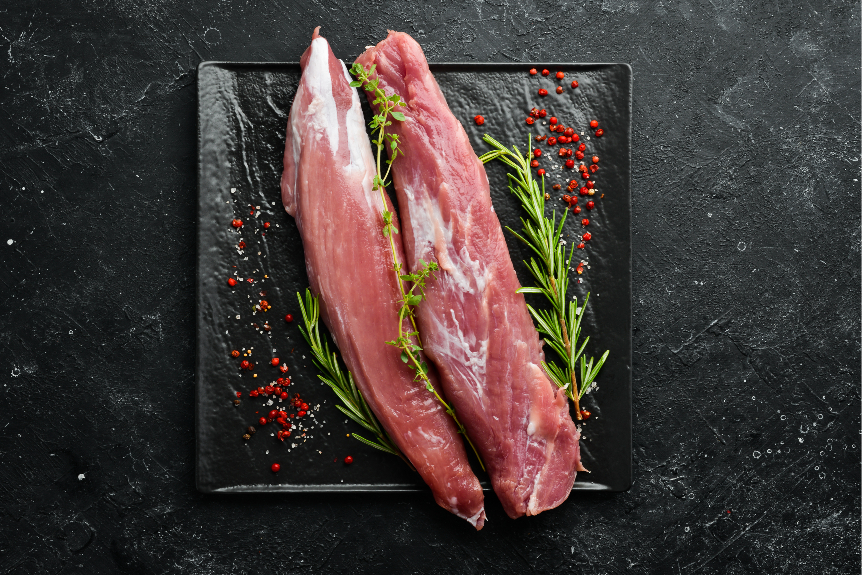 Pork_Tenderloin_Raw_withHerbs_BlackStoneBackground_L (1)